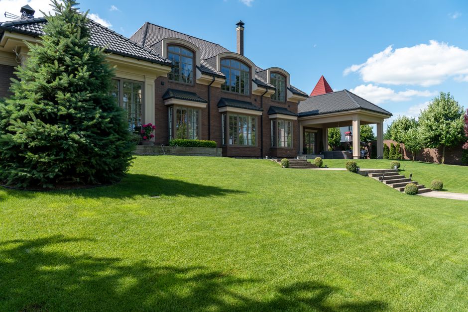 Pristine green lawn and professional landscaping